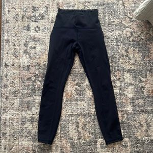 Lululemon side mesh leggings. Fast and free material. Color navy. Size 4